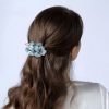 Embroidered hairpin with butterfly and flower details